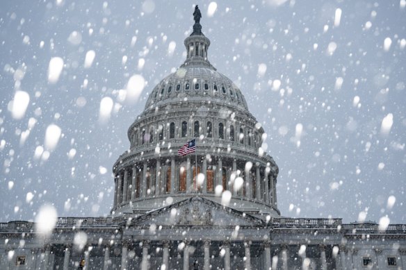 The US Capitol weathers heavy snow in Washington, DC.