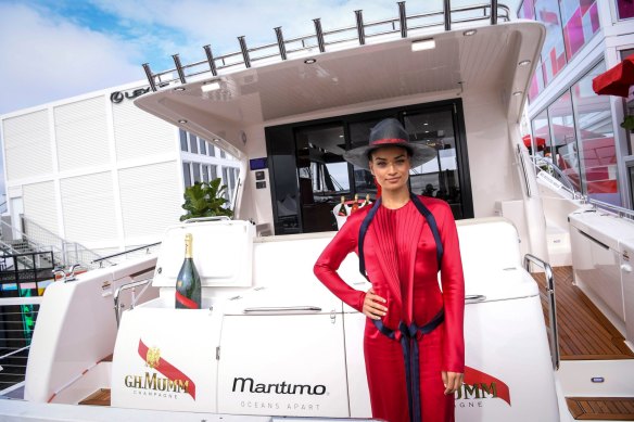 Model Shanina Shaik shows off the multimillion-dollar yacht that was implanted in the Mumm marquee in 2017.
