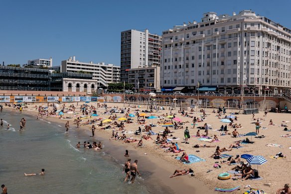 People on the beach in Marseille. The plan to scrap two public holidays has set off a political storm in France.