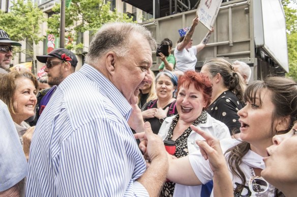 Craig Kelly arrives to address the crowd at the protest. 
