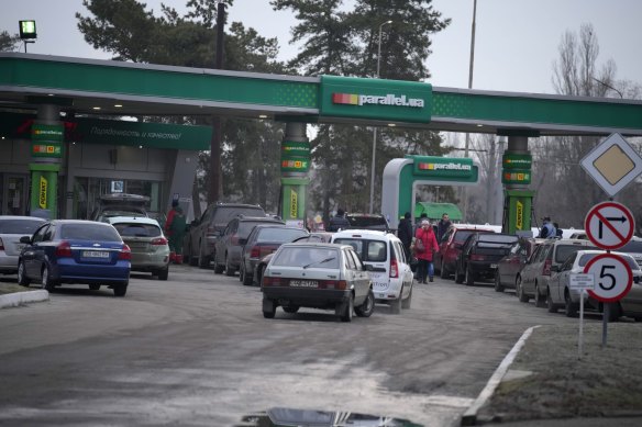 People queue for fuel at a gas station in Sievierodonetsk, in the Luhansk region in eastern Ukraine.