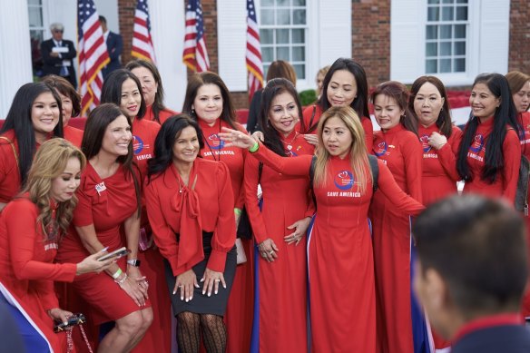 Women in Save America PAC dresses before a speech by Donald Trump during an event at Trump National Golf Club in Bedminster, New Jersey on June 13.