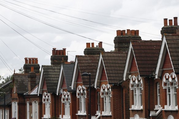 Chimney pots line the rooftops of houses in the Herne Hill district of London.