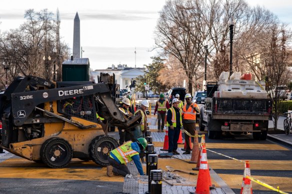 Workers begin ripping up the Black Lives Matter mural located just metres from the White House in Washington.