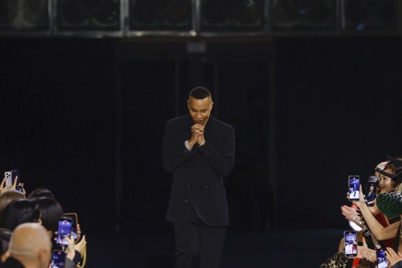 Designer Olivier Rousteing accepts applause after the conclusion of a presentation in Paris in March. 