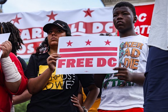 Protesters in Washington, DC, on Saturday. Washington officials have sued President Donald Trump over his deployment of thousands of National Guard troops in the nation’s capital.