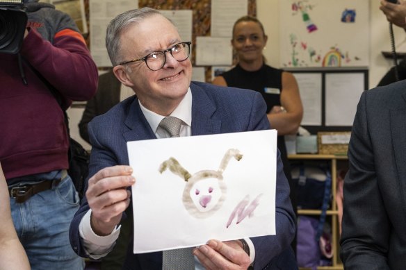 Opposition leader Anthony Albanese with his painting from a childcare centre visit in Bennelong this morning.