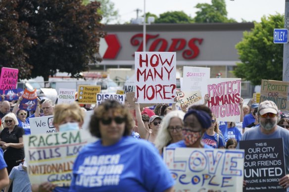 Protesters march down Jefferson Avenue past the site of the Tops massacre during a March for Our Lives rally in support of gun control in Buffalo.