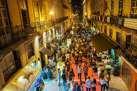 Crowds enjoy the nightlife of Lisbon. 