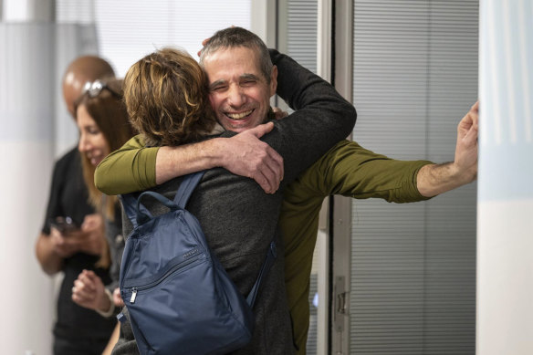 Hostage Fernando Simon Marman hugs a relative after being rescued.