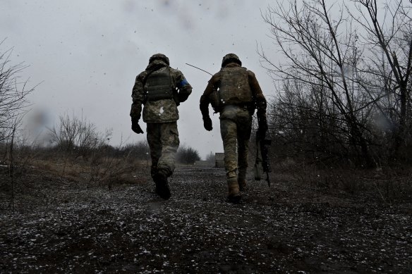 Ukranian fighters walk the line in the Donbas region in eastern Ukraine. 