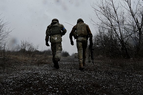 Ukranian fighters walk the line in the Donbas region in eastern Ukraine. 