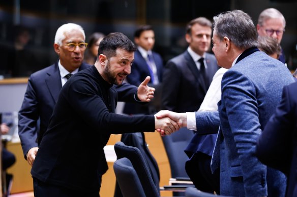 Volodymyr Zelensky shakes hands with Bart De Wever, Belgium’s prime minister,  at a special European Council meeting in Brussels, Belgium, on Thursday.