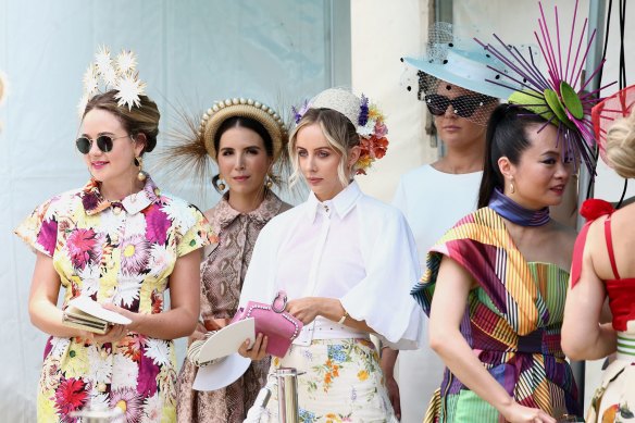 Entrants in the fashions on the field line up at the Magic Millions Race Day at Aquis Park on the Gold Coast.