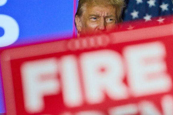 Former US president Donald Trump during a campaign event in Green Bay, Wisconsin, on Tuesday. The campaign banner reads “fire Biden”.