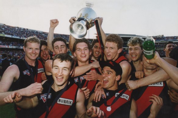 Gavin Wanganeen and Dustin Fletcher with teammates at the 1993 grand final. 