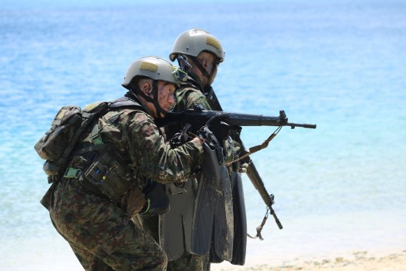 Japanese soldiers take part in joint military exercises between the U.S., Japan, France and the United Kingdom in Guam in 2017.