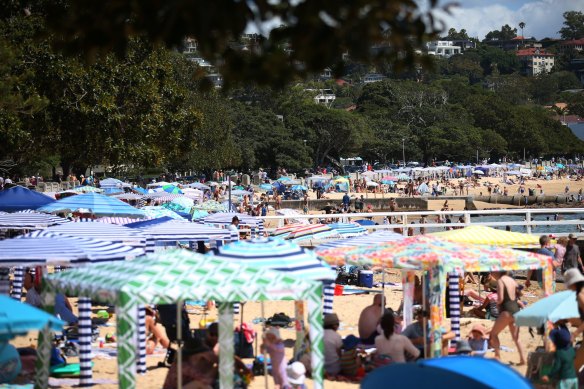 People soak up the sun at Balmoral Beach in Sydney’s north, 