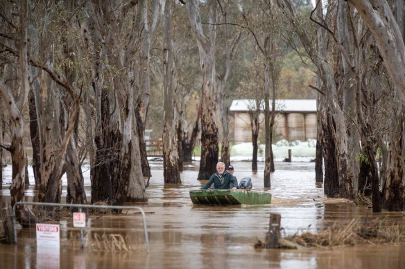 Craig Sherwood and Craig Watts return after taking hay to cattle stranded on a small patch of high ground in flooded Seymour. 