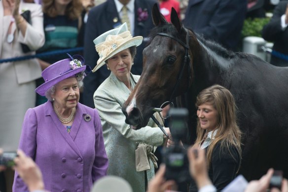 Britain's Queen Elizabeth II, with her daughter Princess Anne and her horse Estimate, who won the Gold Cup at Royal Ascot in 2013.