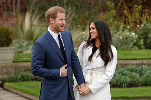 Harry and Meghan pose for photographers during a photo call in the grounds of Kensington Palace to mark the couple’s engagement in 2017.