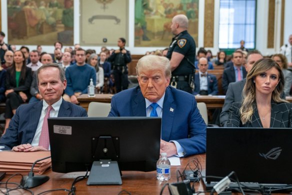 Donald Trump, flanked by lawyers, during a separate trial at the New York State Supreme Court this month.