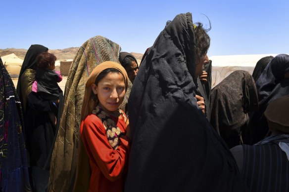Women and children wait outside an out patient department facility in Regreshan IDP camp in Herat Province. Jonathan Lee's book makes the point that the Afghan people have played little part in the disorder that has affected the country in the past four decades. 