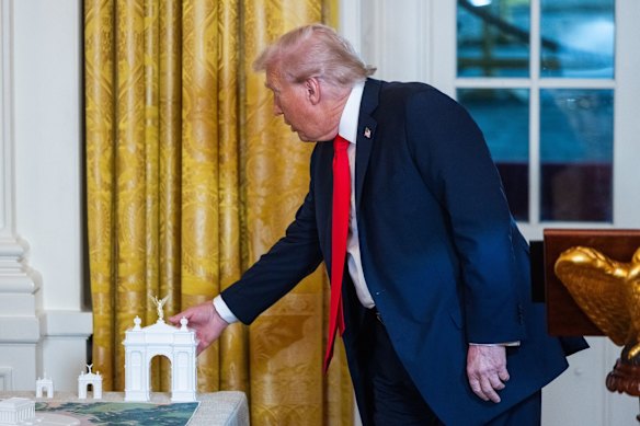 US President Donald Trump with a model of the planned for Washington DC’s Memorial Circle in October last year.