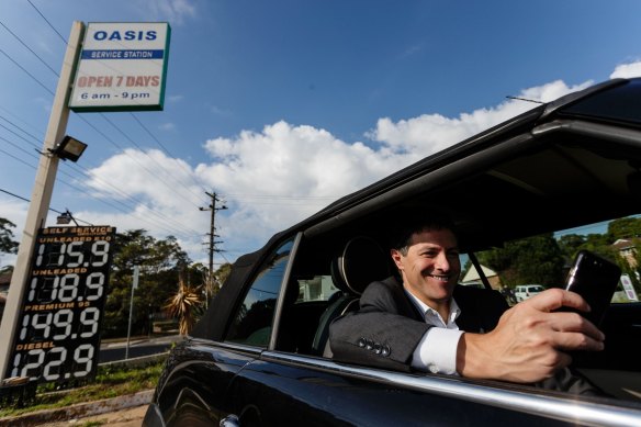 Former NSW finance minister Victor Dominello using his FuelCheck app. 