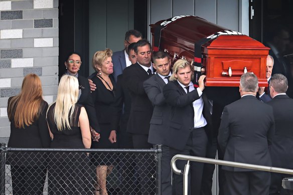The coffin of Shane Warne is carried out by his son Jackson on March 20, 2022.