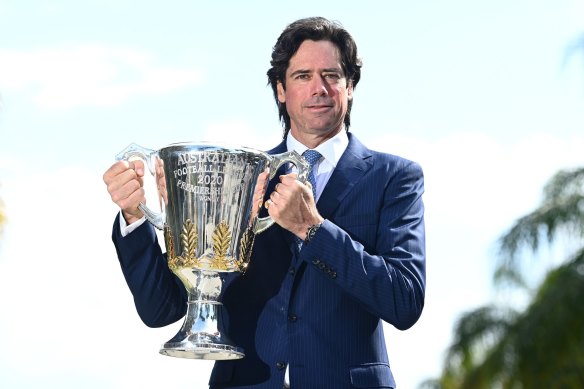 AFL boss Gillon McLachlan holding the premiership cup. 