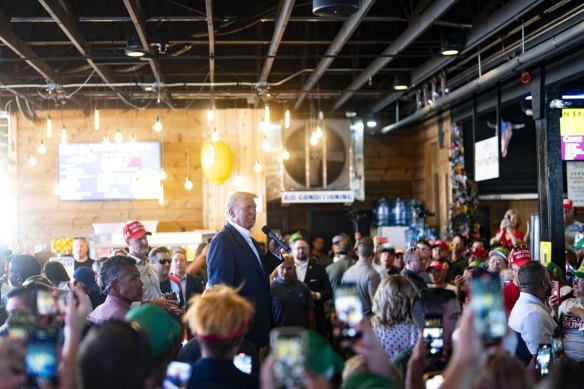 Former President Donald Trump speaks at the Steer N Stein while attending the Iowa State Fair.