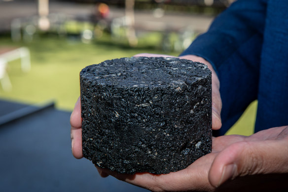 A slab of blacktop containing recycled plastics.