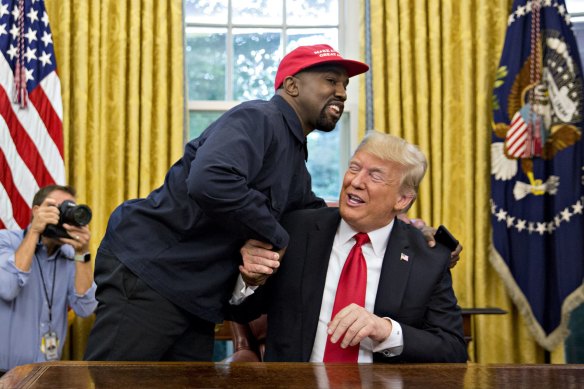 Rapper Kanye West shakes hands with US President Donald Trump during a meeting in the Oval Office of the White House in 2018. 