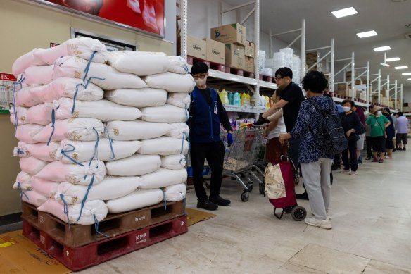 Customers wait in line to buy 20kg bags of salt in Seoul, South Korea,