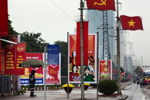 Vietnamese national flags and billboards advertising the 12th National Congress of the Communist Party of Vietnam in Hanoi in 2016.