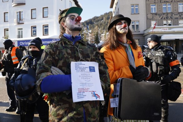 Protesters in clown outfits demonstrate against the World Economic Forum in Davos, Switzerland.