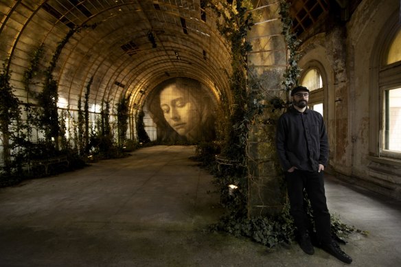 Artist Rone and his installation TIME above Flinders Street Station.