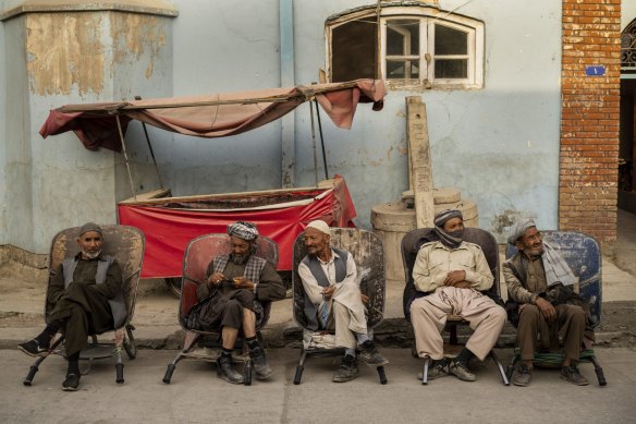 Labourers wait in the street to be hired, in Kabul, Afghanistan, on Sunday.