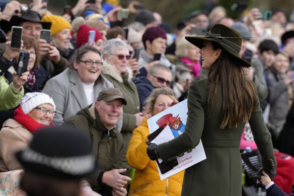 Kate, Princess of Wales smiles at the crowd after attending the Christmas day service in Norfolk in 2022. 