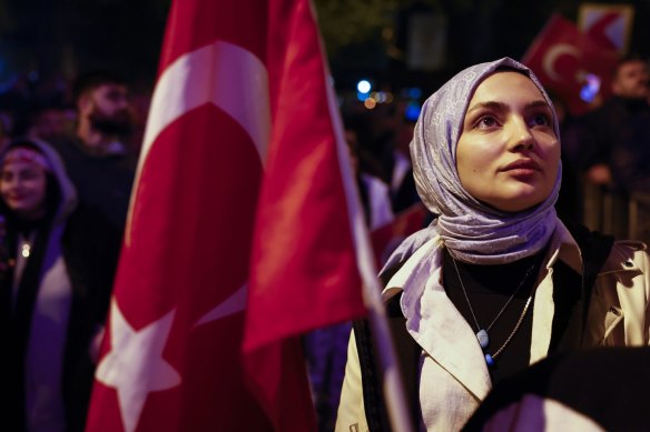 Supporters of Turkish President Recep Tayyip Erdogan celebrate at the AK Party headquarters in Istanbul, Turkey.