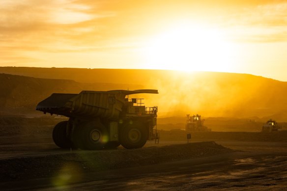 Komatsu dump trucks carrying ore at Rio Tinto’s Oyu Tolgoi open-pit copper mine.