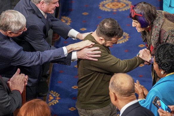 Ukrainian President Volodymyr Zelensky is welcomed at a joint meeting of the US Congress in December 2022. Despite initially emphasizing support, Zelensky has no guarantees that financial support from the United States will continue.