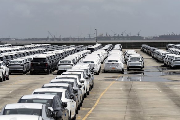 Vehicles waiting for shipment at a shipping terminal in Shanghai, China.