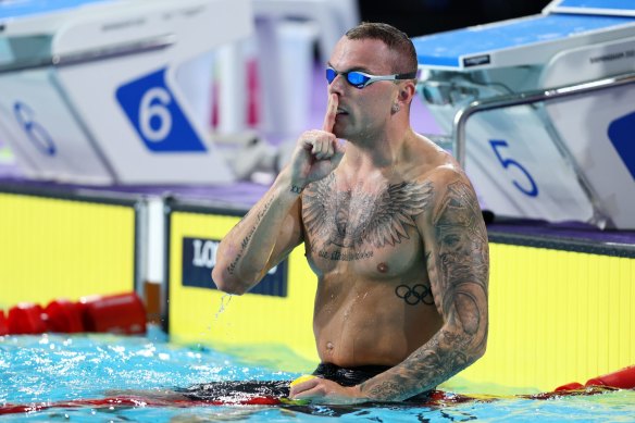 Kyle Chalmers signals for silence after winning gold in the Commonwealth Games. He later said the media focus on his relationships with Emma McKeon and Cody Simpson affected his mental health.