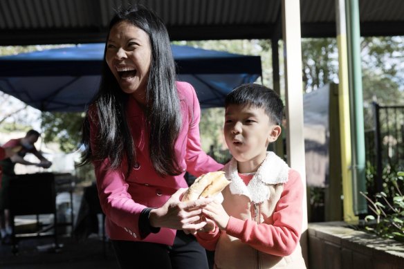 Labor candidate for Reid Sally Sitou and son Max, 6, after voting at North Strathfield Primary. 