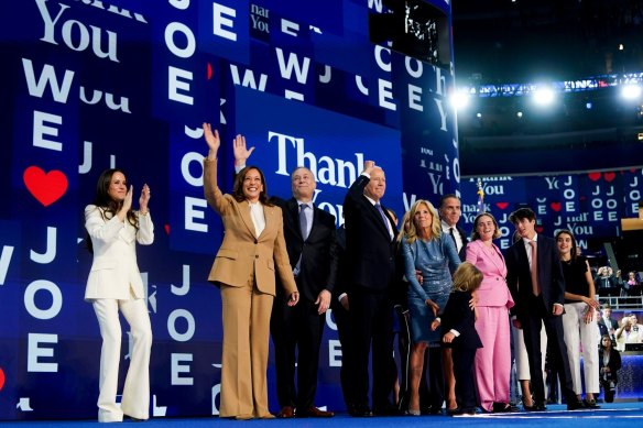 Kamala Harris and Joe Biden with their families on stage at the end of day one of the DNC.