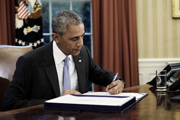 Barack Obama working in the Oval Office  when he was president in 2016.