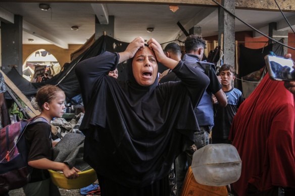 A Palestinian woman cries out after an Israeli airstrike on a school in Gaza this week. 