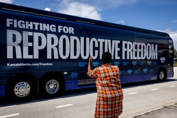 A “Reproductive Freedom Bus” leaves after the kick-off of the Harris-Walz campaign’s reproductive rights bus tour in Boynton Beach, Florida, on Tuesday.